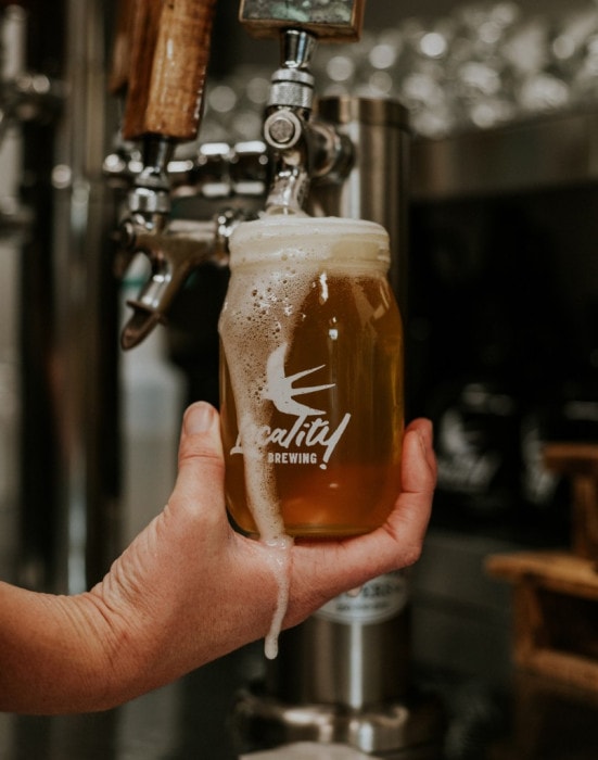 Pouring a beer at Locality Brewing in Langley on the Langley Ale Trail